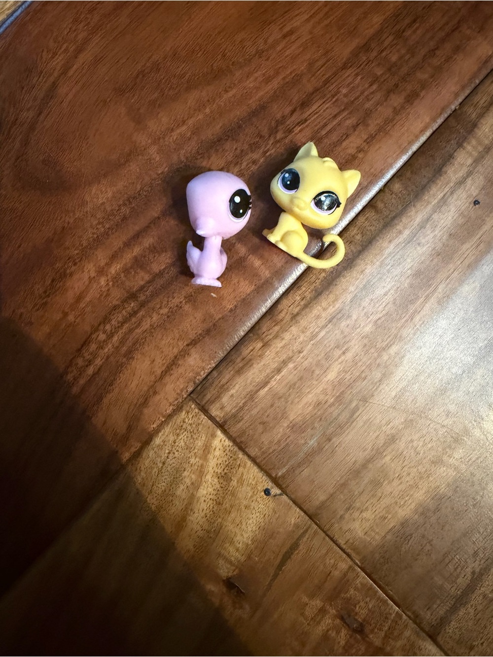 The littlest pet shop figurines: flamingo and cat